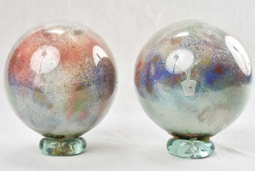 Pair of 7" antique blown glass wig / hat displays